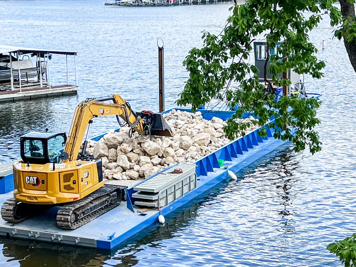 Work barge on the water supporting marine construction