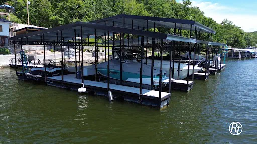 Custom two-story boat dock on a calm lake