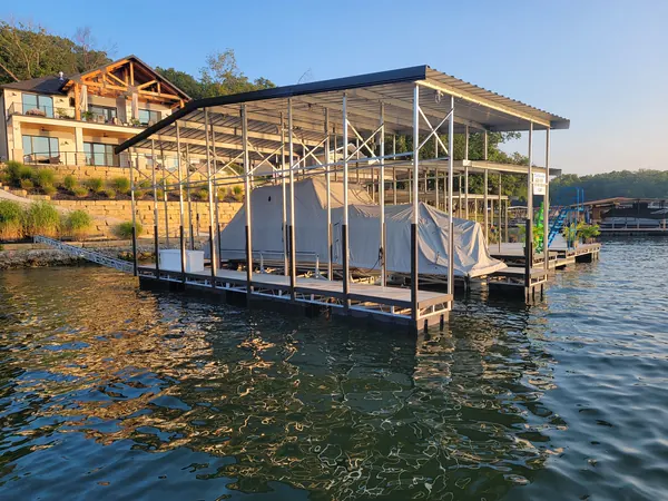 Two-story boat dock with upper deck at sunset