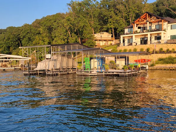 Boat dock and lake house in evening light