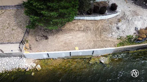 Solid lakefront seawall protecting the shoreline behind it